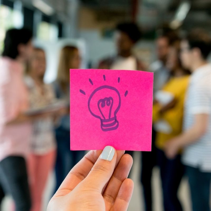 Sticky note with a light bulb for innovation